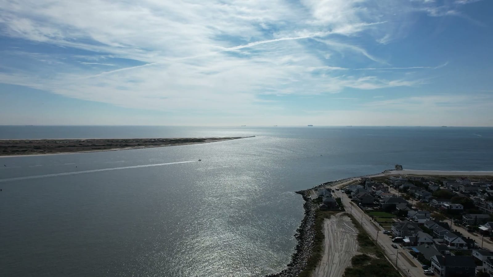 Jones Inlet from the air, with Jones Beach across the water and the rock-lined east end of Point Lookout in the foreground